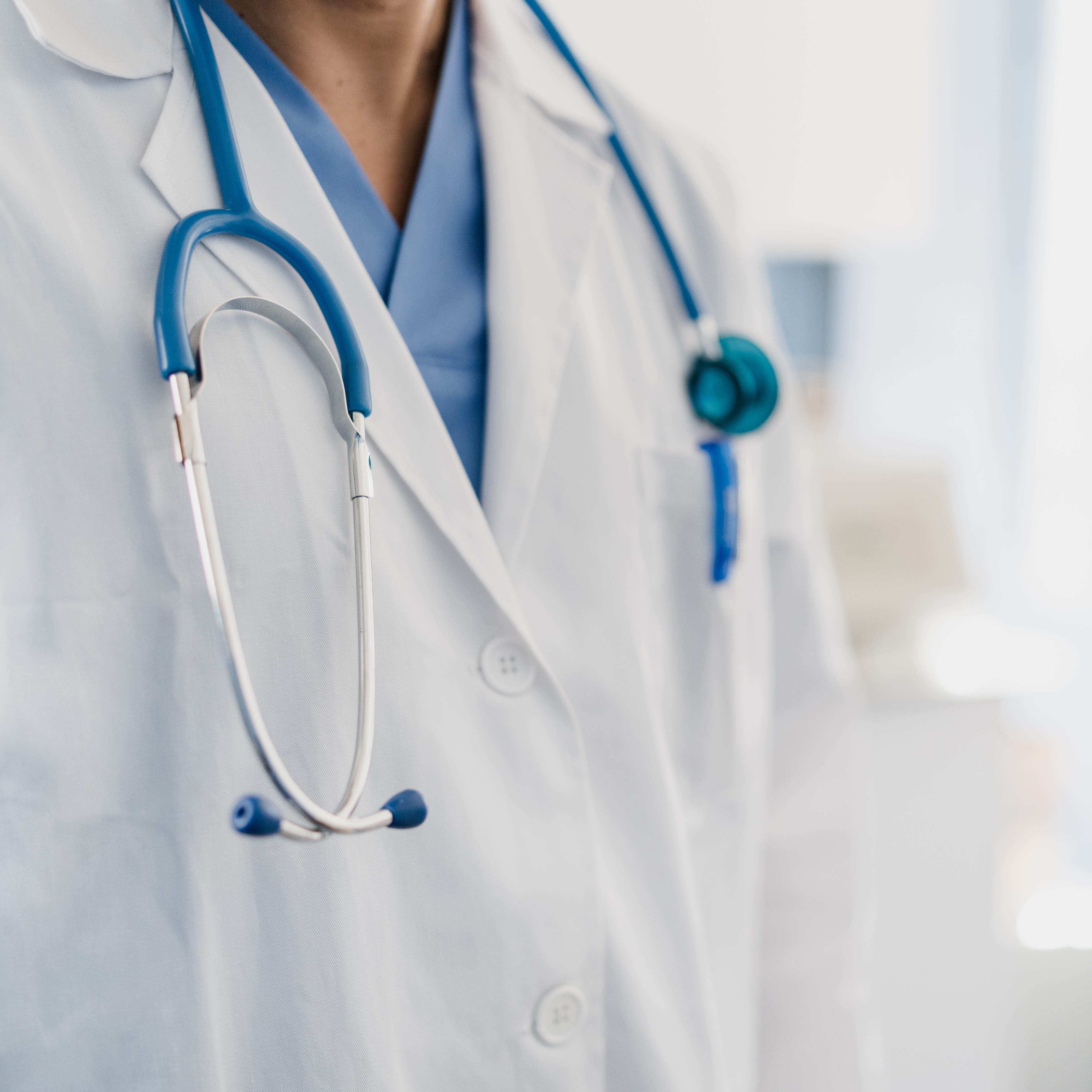 close-up of a doctor's gown with stethoscope close up of a doctor's gown with stethoscope