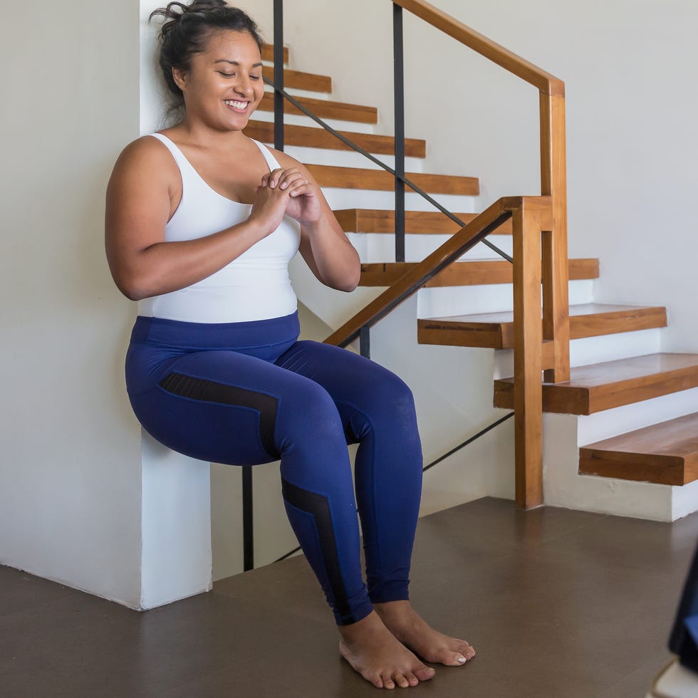 woman performing a wall sit